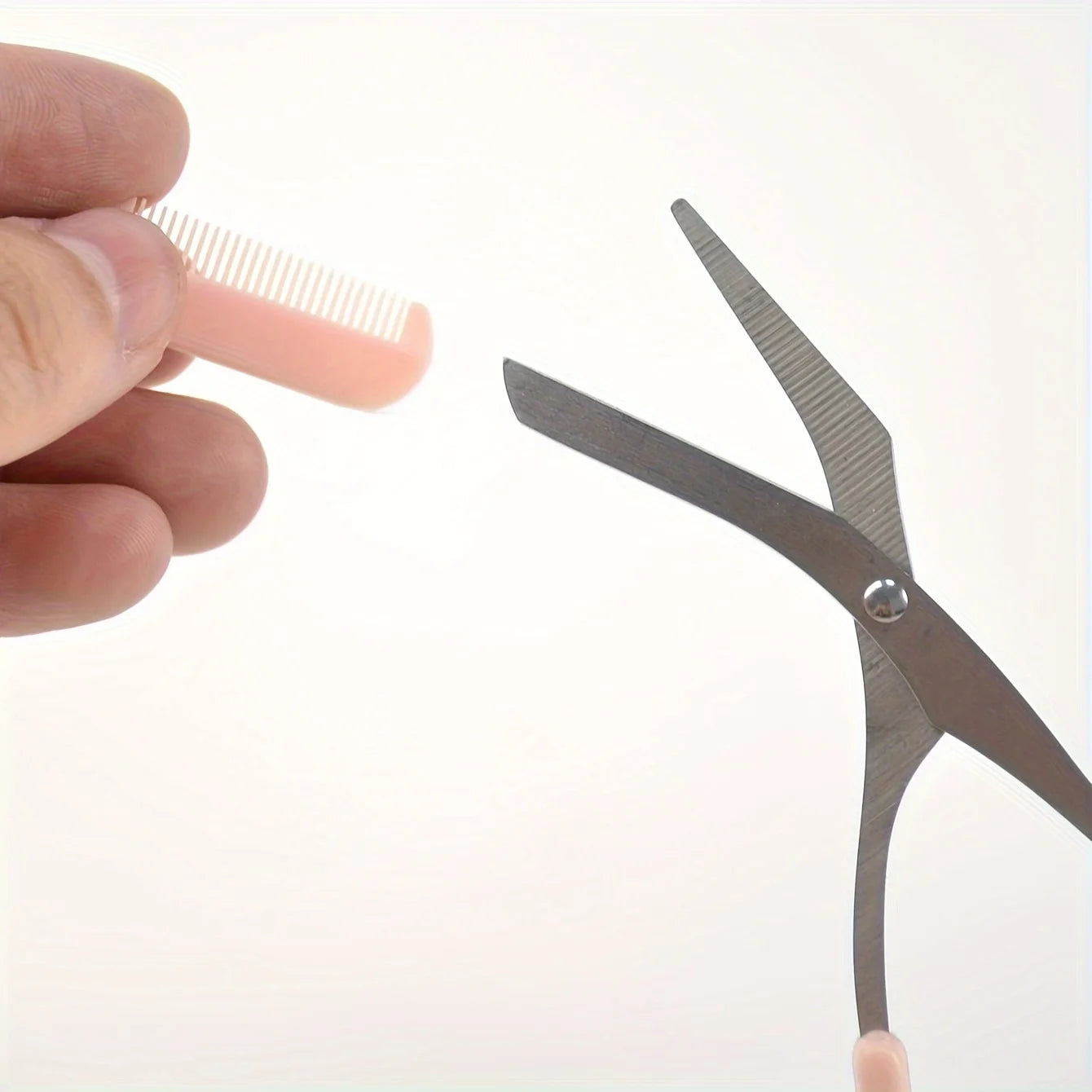 Eyebrow trimming scissors with built-in comb.