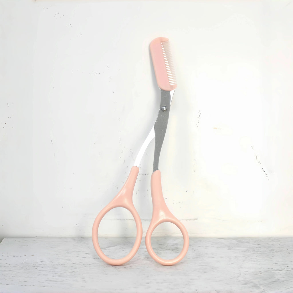 Eyebrow trimming scissors with built-in comb.