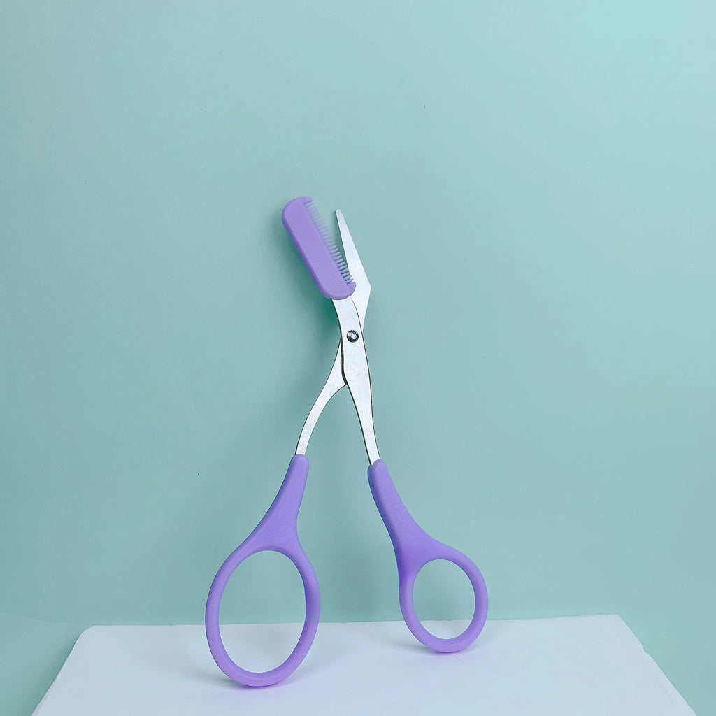Eyebrow trimming scissors with built-in comb.